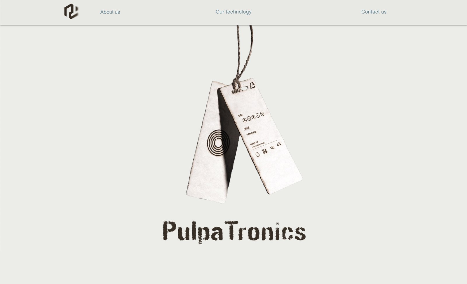 A PulpaTronics website page: a slim navigation bar with the logo mark and About us, Our technology and Contact us links, the paper NFC tags photographed hanging on a string, and the wordmark set in a rough textured typeface below
