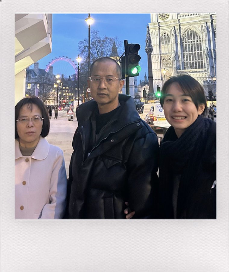 Yidan standing with her parents on a London street, as a Polaroid
