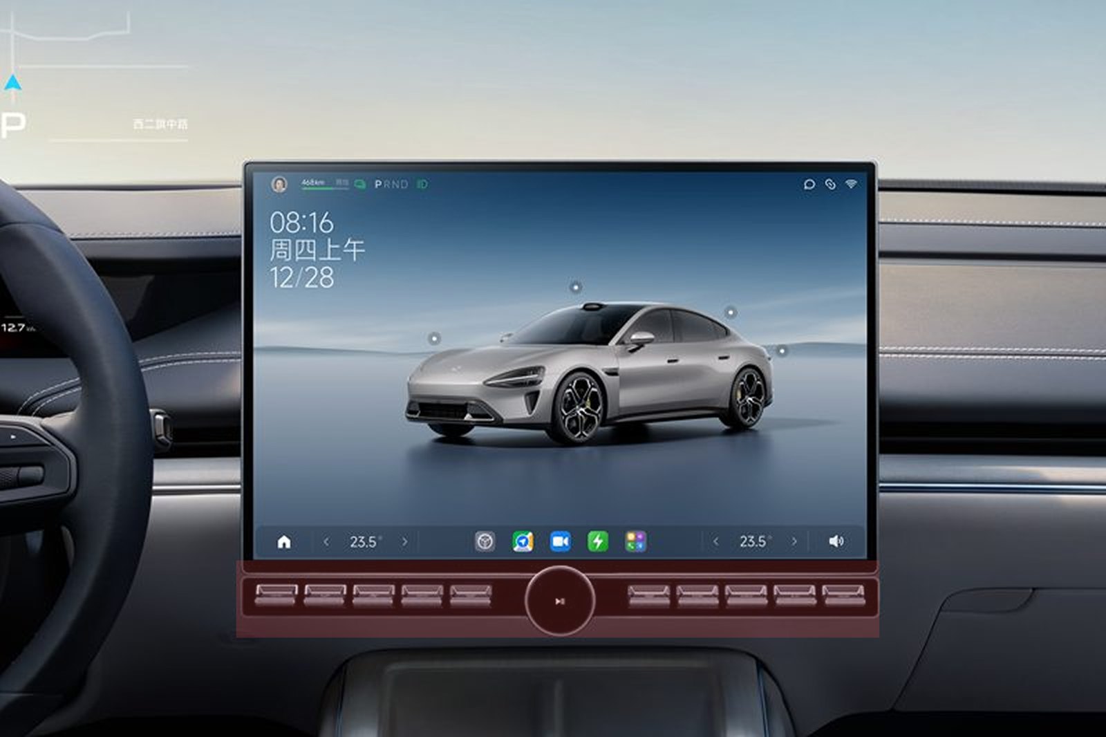 The centre screen in the cabin, with the physical key strip on the frame directly underneath it marked in red: ten keys either side of a round play control