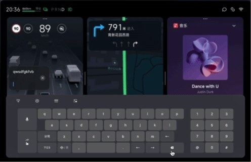 The prototype running: text is typed into the field while the driving, navigation and music cards above the keyboard stay legible throughout