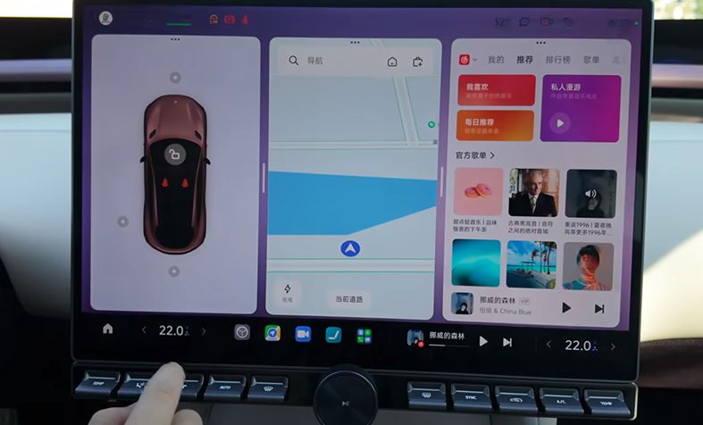 The centre screen still on its home layout, untouched, while a hand reaches down to press a key on the physical strip below the screen