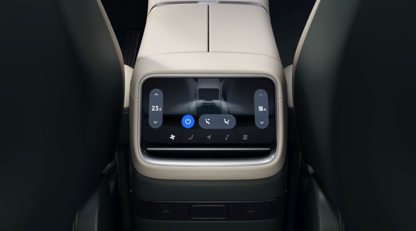 The rear screen behind the front seats, showing the seat massage control: temperature on the left, intensity on the right, a seat diagram in the middle, and a row of function icons underneath