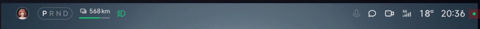The same top bar after the change: a microphone icon has joined the right-hand cluster, and a small green dot sits at the very end, past the clock